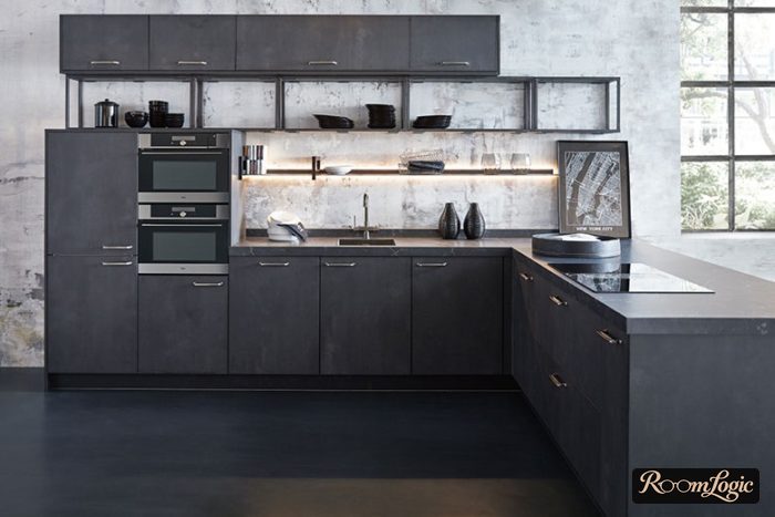 black kitchen next to concrete wall