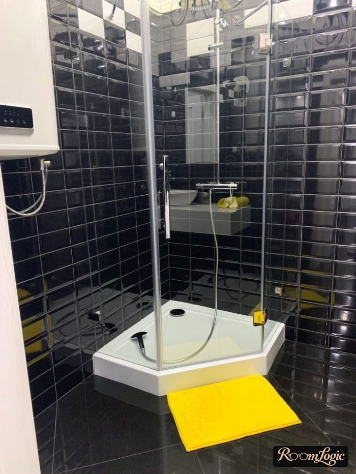 black shower with yellow accent