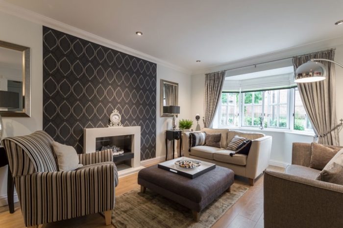 black wallpaper on an accent wall in the living room