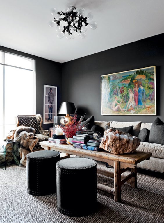 black walls with a picture in the living room