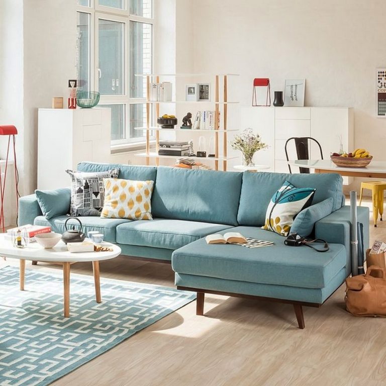blue corner sofa on wooden legs