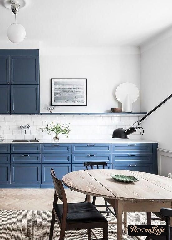 blue kitchen partially without upper cabinets