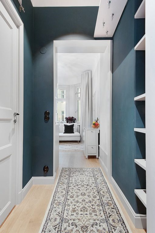 blue walls in a narrow hallway