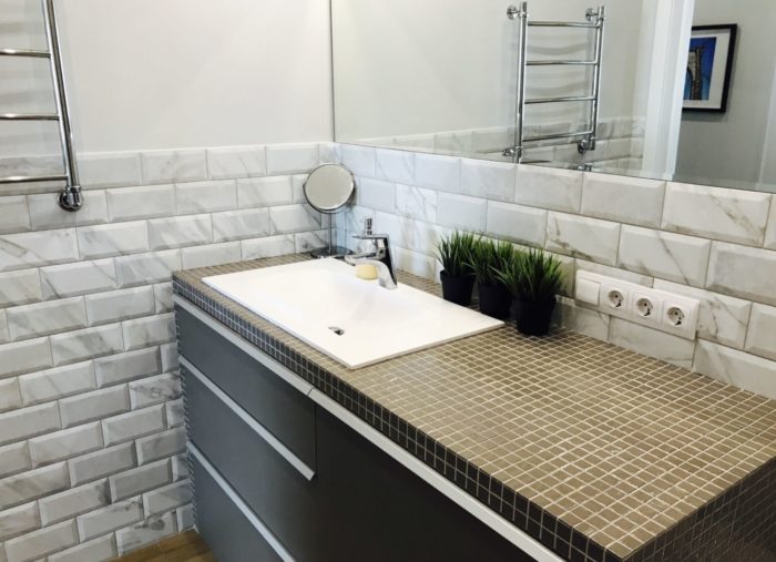 brick tile installation to the middle of the wall