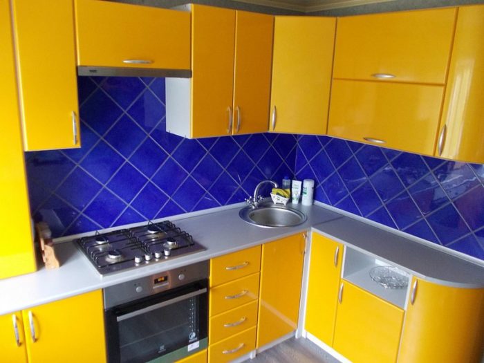bright yellow kitchen in tiny apartment