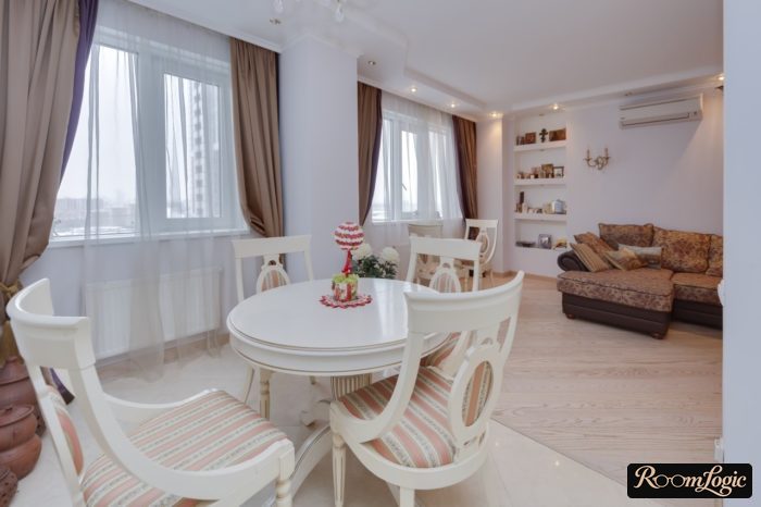 brown blackout curtains in a kitchen-living room in provence style