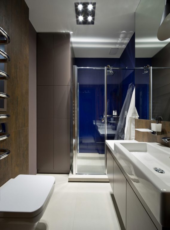 brown tile bathroom with shower enclosure design