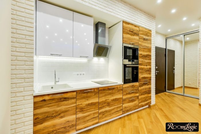 built-in kitchen with veneer wood fronts and white glossy upper cabinets