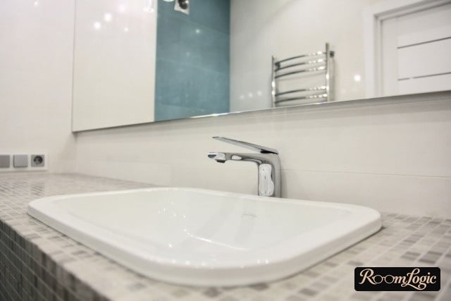 Built-in sink in a mosaic countertop in a modern bathroom