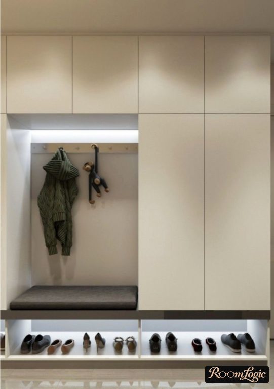 Built-in white compact entryway for narrow hallway