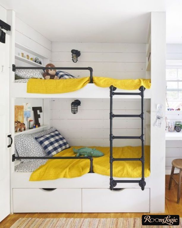 A two-tier white bed with yellow bedding for two boys in a kids' room