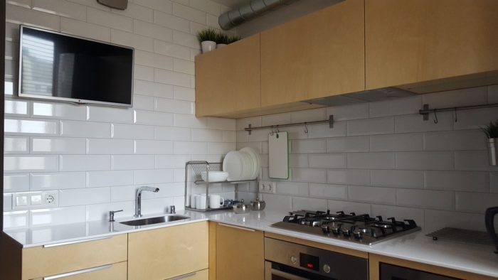 cabinet fronts in light wood on a small kitchen
