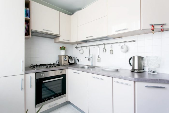 cabinet fronts in milk chocolate color in a small kitchen