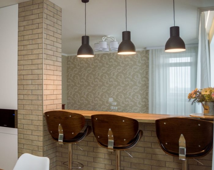 capital bar counter between kitchen and living room