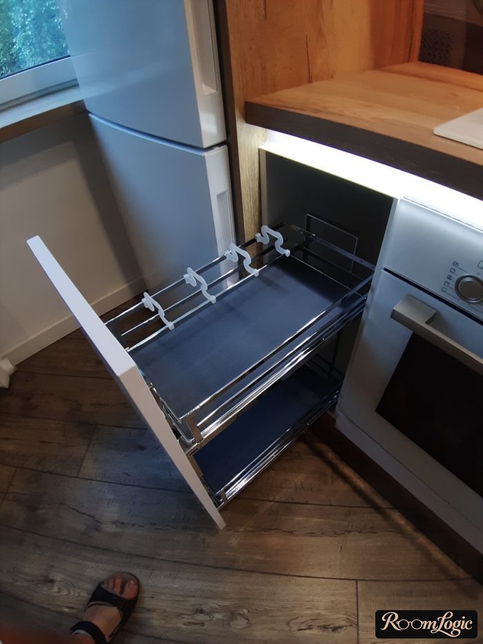 cargo between cooktop and refrigerator in corner of kitchen