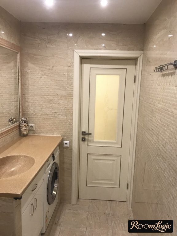 cast countertop with sink over washer