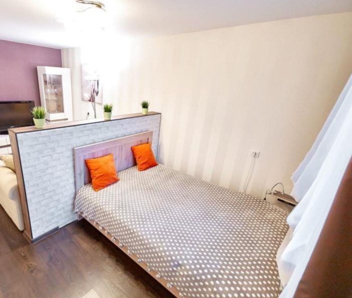 child's bed in a room with parents