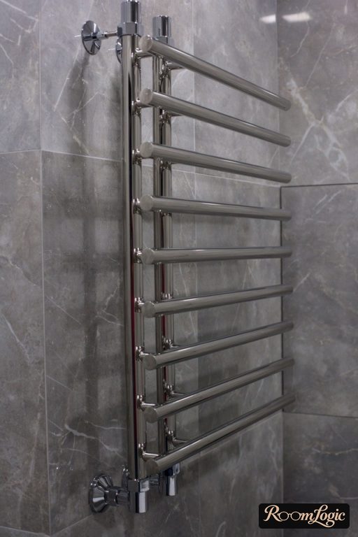 chrome towel rack in loft style bathroom