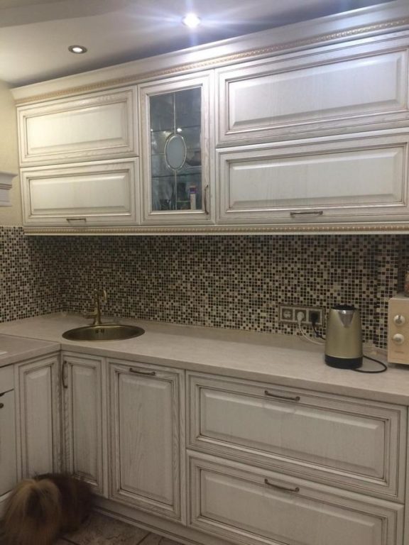 classical kitchen with mosaic on backsplash