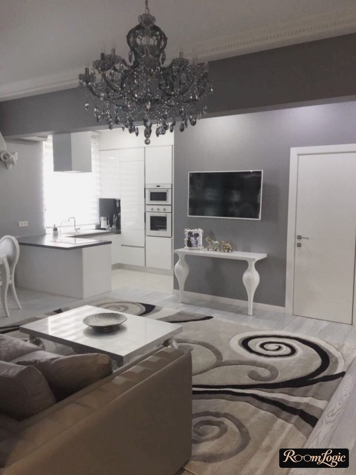 classical styled kitchen-living room with an island