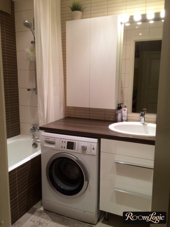 closet for storing items in small combined bathroom design