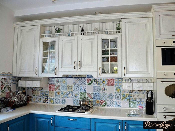 Colored patchwork tile on the Provence-style backsplash in the kitchen