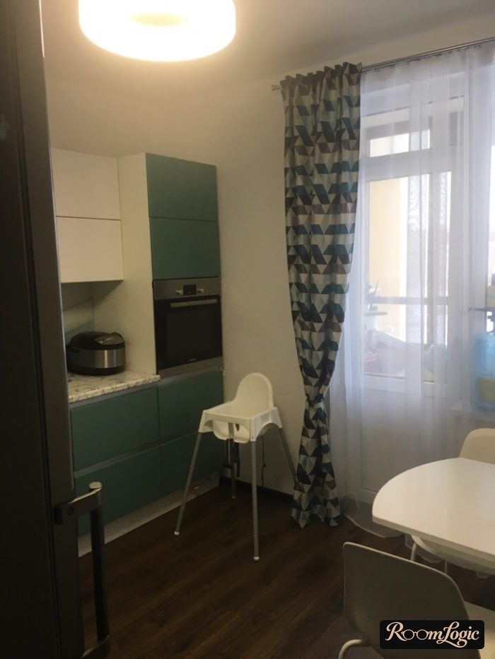 combination of curtains and sheer curtains in a kitchen with a balcony