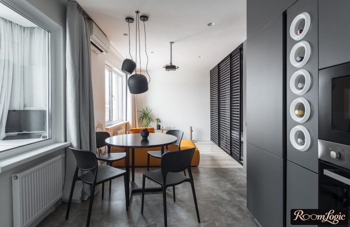 combination of gray and orange in the kitchen-living room