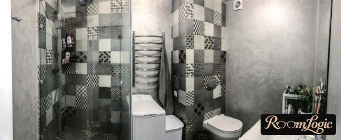 combination of gray tile and decorative plaster in the bathroom
