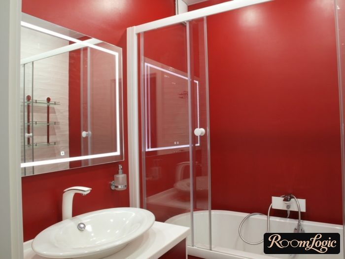 combination of red and white in the bathroom of a tiny apartment