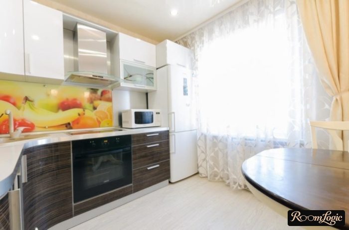 combination of sheer curtains and regular curtains on the kitchen