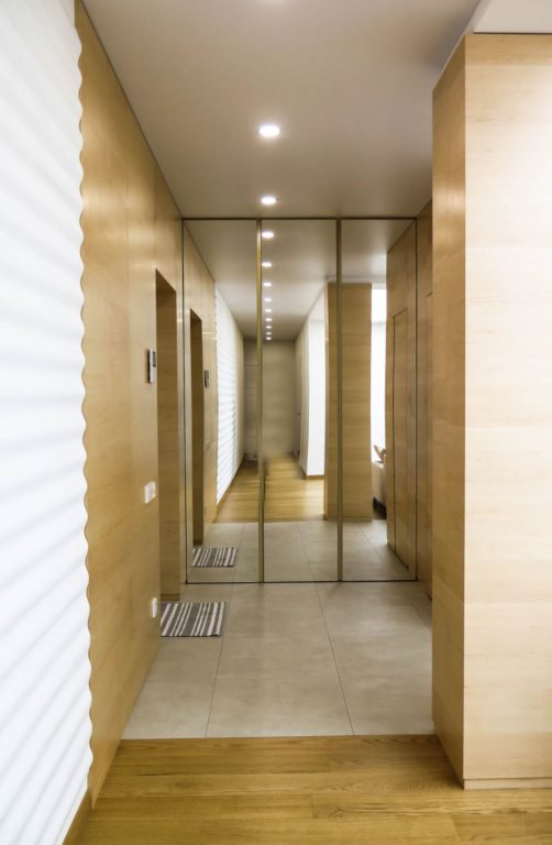 combination of tile and parquet in the hallway