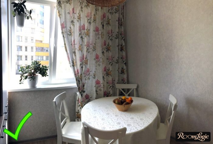 combination of wallpaper and curtains in a small Provence-style kitchen
