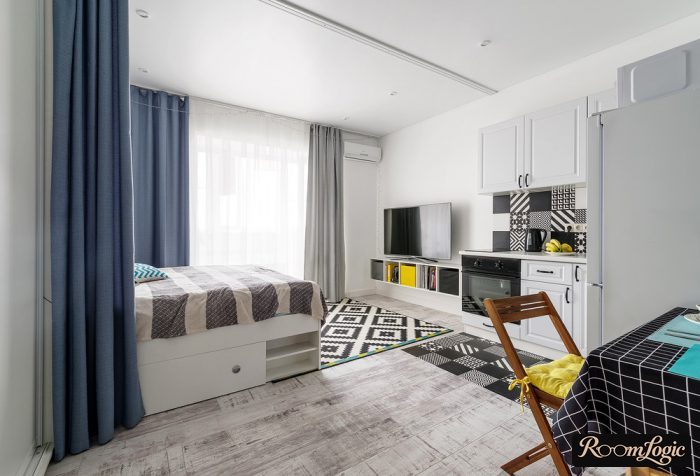 combination of yellow and blue in the interior of a studio apartment