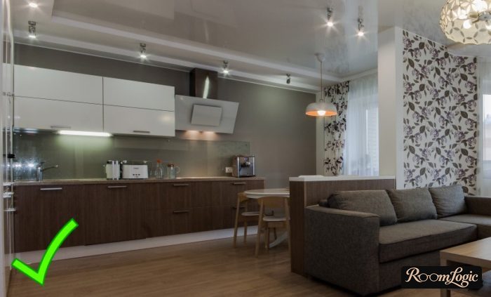 combined wallpapers in the kitchen-living room interior