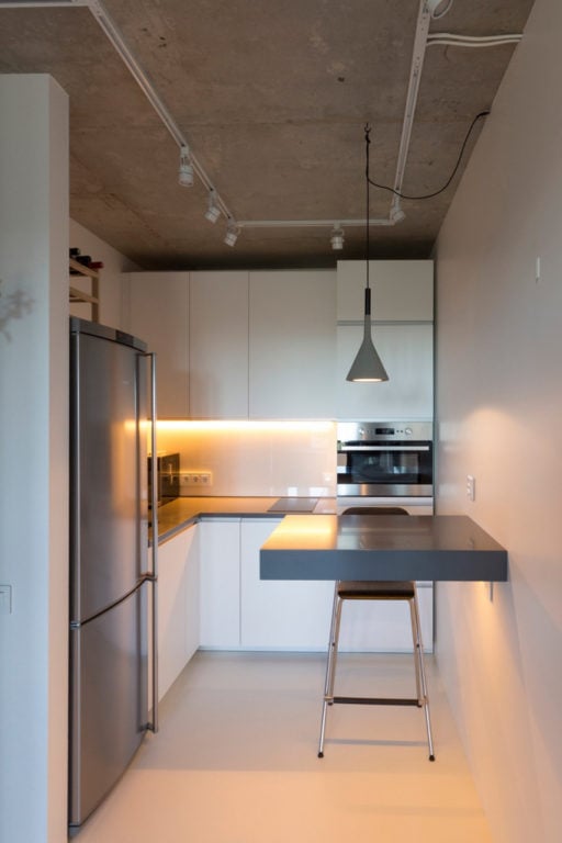 concrete ceiling in a small loft kitchen