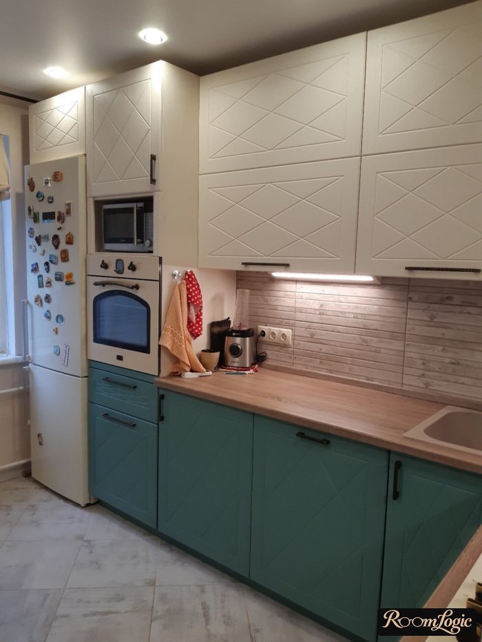 corner beige-light blue kitchen with refrigerator against the wall