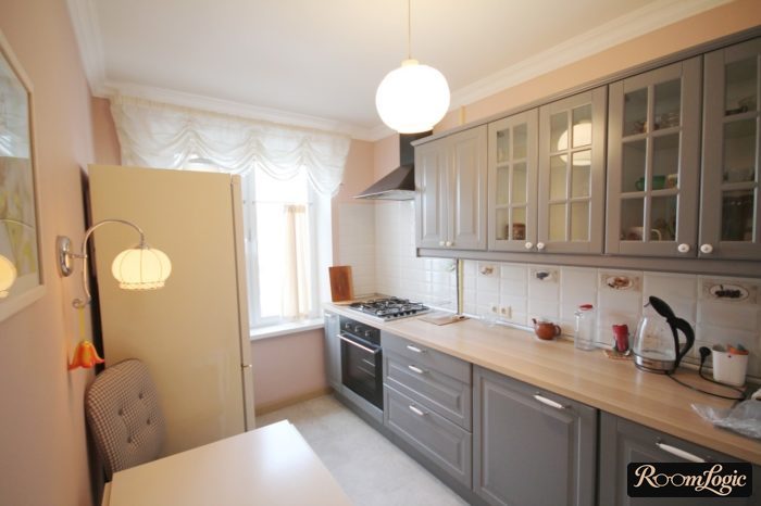 corner gray kitchen in neoclassical style in tiny apartment