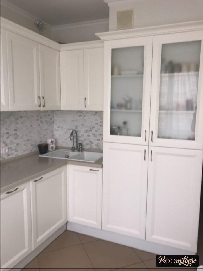 corner kitchen with refrigerator