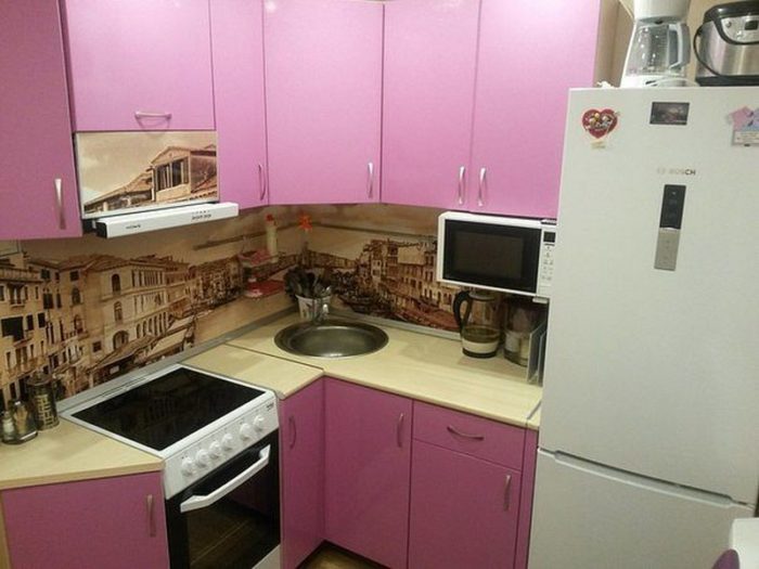 corner pink kitchen in a tiny apartment