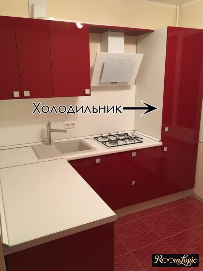 corner red and white kitchen cabinets with built-in refrigerator