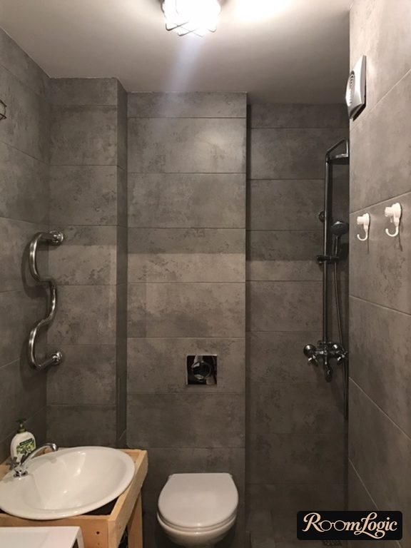 dark gray concrete-look tile bathroom design