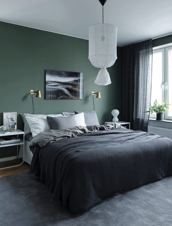 Dark green walls with a dirty appearance in the bedroom