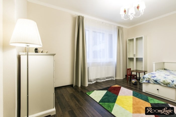 dark laminate and bright carpet in a boy's room