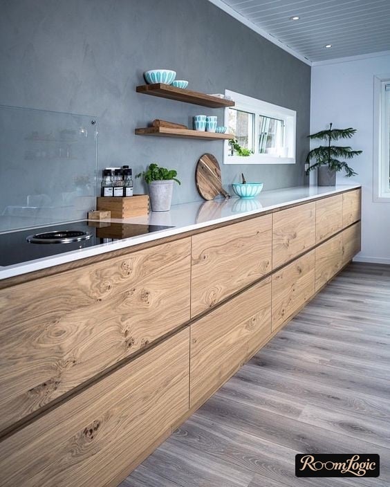 decorative plaster on the kitchen backsplash behind the glass skin cabinet