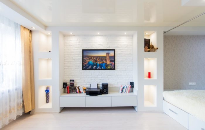design of a bedroom with a bed in a one-bedroom apartment