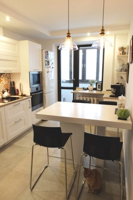 design of a kitchen with a white breakfast bar