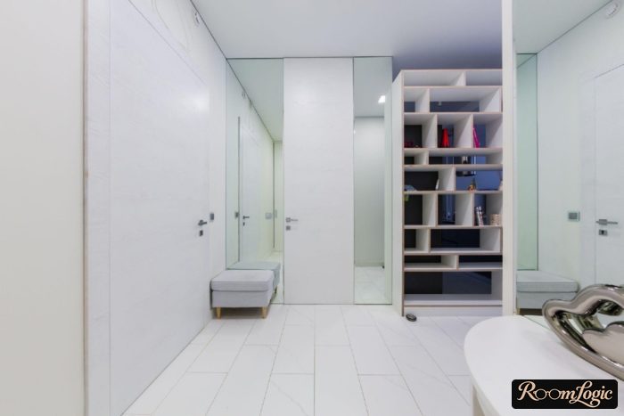 design of a large entryway with a sectional closet