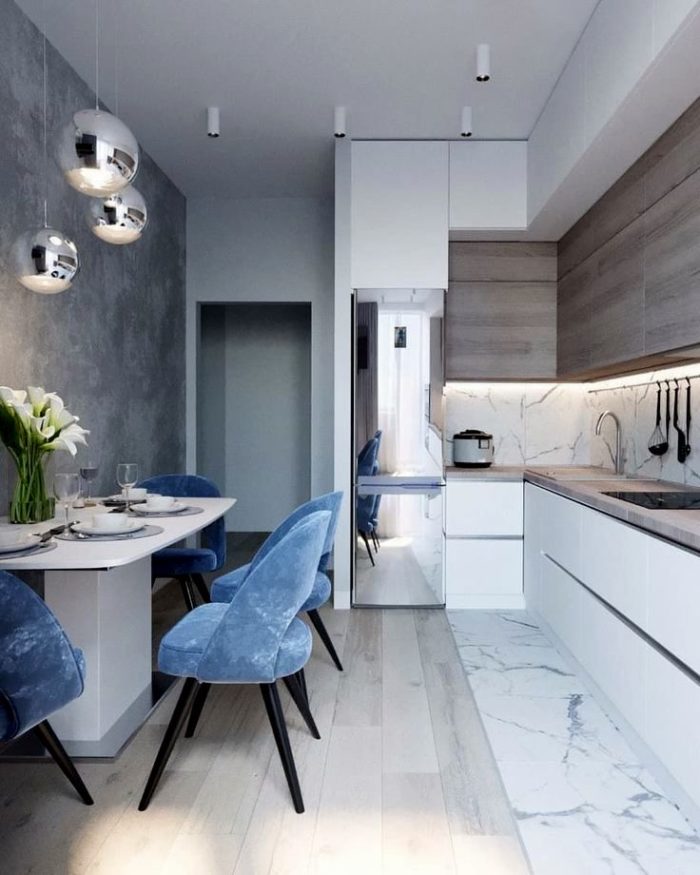 design of a modern kitchen with a chrome refrigerator and lights