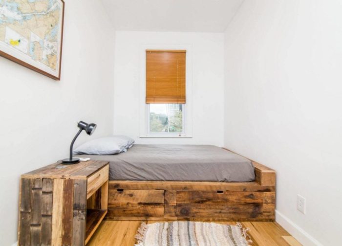 design of a small bedroom with a bed by the window